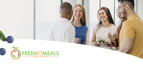 Diverse, smiling employees engaged in a positive office environment, with "Corporate Wellness" text prominently displayed, emphasizing a healthy workplace culture.