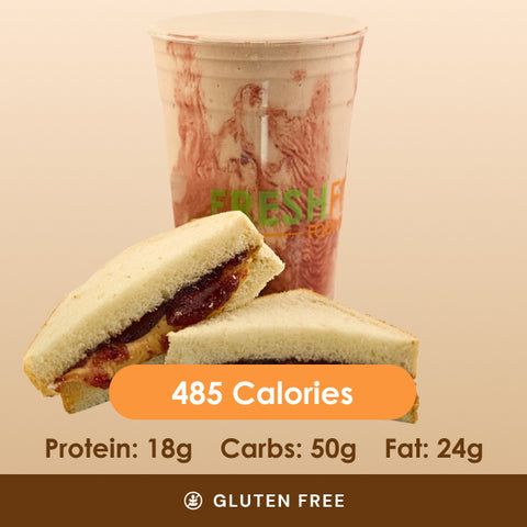 A classic peanut butter and jelly sandwich, cut in half, placed in front of a matching peanut butter and jelly swirl smoothie.