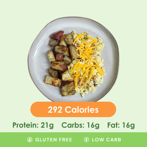 A hearty western scramble featuring fluffy eggs with cheese and peppers, served alongside crispy roasted potatoes.