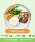 A perfectly cooked blackened Cajun salmon fillet served with tender green beans and creamy mashed potatoes, displaying its nutritional information.