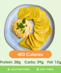 A bubbling hot and cheesy buffalo chicken dip, garnished with fresh green onions, accompanied by crisp celery sticks for a healthy scoop.