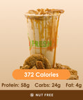 A decadent caramel cookie shake drizzled with caramel sauce, with crushed cookies and a whole cookie around its base, displaying its nutritional information.