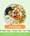 A vibrant chicken burrito bowl featuring tender chicken, black beans, fluffy rice, fresh pico de gallo, and a creamy green sauce.