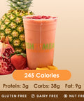 A vibrant pink smoothie with pomegranate seeds, next to pineapple and a strawberry.
