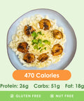 Creamy shrimp alfredo pasta, generously coated in a rich white sauce, garnished with fresh herbs, and accompanied by a side of crisp broccoli.