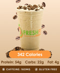 A tall glass of creamy vanilla energizer drink, garnished with scattered coffee beans, promising a delicious boost.
